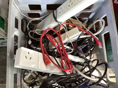 Boxes of appliance cords, chargers, power boards